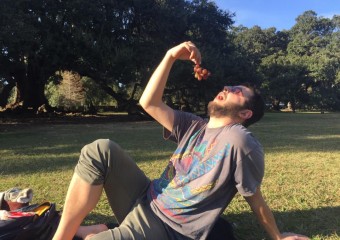 Man eating grapes