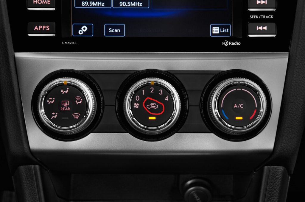 Subaru's air re-circulation button showing a car with a curved arrow