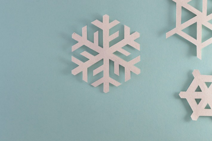 White snowflake on blue background